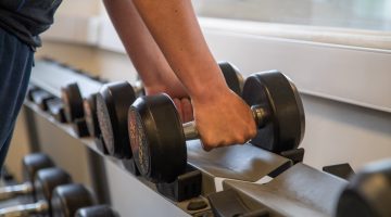 Student using gym equipment